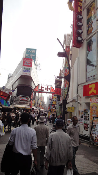 a crowd at one of the entrances to the market